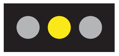 Horizontal traffic signal with the centre yellow light illuminated